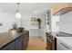 Bright kitchen featuring stainless steel appliances, light-green cabinets, and dark island at 4219 26Th N Ave, St Petersburg, FL 33713
