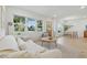 Spacious living area with ample natural light, modern furnishings, and a view into the dining space at 4219 26Th N Ave, St Petersburg, FL 33713