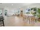 Bright, airy living room with modern decor, hardwood floors, and large windows showcasing the exterior landscape at 4219 26Th N Ave, St Petersburg, FL 33713