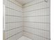 Sleek walk-in shower featuring modern vertical white tiling at 4219 26Th N Ave, St Petersburg, FL 33713