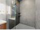 Glass-enclosed shower with decorative tile and brass fixtures and shower head at 4219 26Th N Ave, St Petersburg, FL 33713