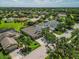 Aerial view of a lovely single-story home in a well-maintained community with lush landscaping at 4410 Natures Reach Ter, Parrish, FL 34219