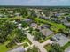 Aerial view showcasing this home's neighborhood location, mature trees, and proximity to green spaces at 4410 Natures Reach Ter, Parrish, FL 34219