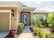 Charming home exterior featuring a well-manicured lawn, and mature landscaping at 4410 Natures Reach Ter, Parrish, FL 34219
