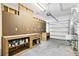 Well-organized garage featuring a workbench, pegboard, storage, and two-car capacity at 4410 Natures Reach Ter, Parrish, FL 34219