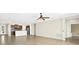 Open-concept living space with kitchen island and views to the outside at 4410 Natures Reach Ter, Parrish, FL 34219