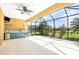 Screened in patio area with outdoor kitchen and stainless steel grill at 4410 Natures Reach Ter, Parrish, FL 34219