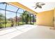Screened patio with fan overlooking the landscaped backyard and swimming pool area provides an outdoor living space at 4410 Natures Reach Ter, Parrish, FL 34219