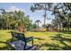 Community playground with swings, slides, and safety features at 4410 Natures Reach Ter, Parrish, FL 34219