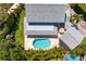 Back aerial view of the house showcasing the pool and backyard at 4935 W Bay Way Pl, Tampa, FL 33629