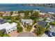 This home has a circular driveway and the property sits on a lush lot near the water at 4935 W Bay Way Pl, Tampa, FL 33629