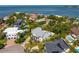 Luxurious waterfront home with lush gardens, mature trees, and views of the bay at 4935 W Bay Way Pl, Tampa, FL 33629