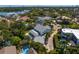 Stunning aerial view of a beautiful two-story home with a private pool and lush landscaping near the waterfront at 4935 W Bay Way Pl, Tampa, FL 33629