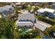 Back aerial view of the house showcasing the pool and covered patio at 4935 W Bay Way Pl, Tampa, FL 33629