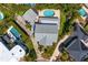 Aerial of a gray roof house showing the in ground pool and backyard play area at 4935 W Bay Way Pl, Tampa, FL 33629