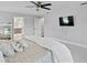 Spacious bedroom featuring a ceiling fan and an en-suite bathroom, providing both comfort and functionality at 4935 W Bay Way Pl, Tampa, FL 33629