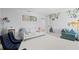 Large bonus room with play area and ample seating at 4935 W Bay Way Pl, Tampa, FL 33629