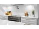 Close up of kitchen featuring modern stainless steel appliances and white marble countertops at 4935 W Bay Way Pl, Tampa, FL 33629