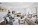 Bright living room with stylish furnishings, hardwood floors, and neutral decor at 4935 W Bay Way Pl, Tampa, FL 33629