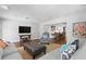 Open-concept living room showcasing hardwood floors, neutral decor, and an inviting seating arrangement at 4935 W Bay Way Pl, Tampa, FL 33629