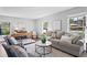 Bright living room with stylish furnishings, hardwood floors, and neutral decor at 4935 W Bay Way Pl, Tampa, FL 33629
