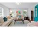 Comfortable living room with bright natural light from the windows and stylish furnishings at 4935 W Bay Way Pl, Tampa, FL 33629