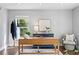 Bright living room featuring a new desk, hardwood floors, and neutral decor at 4935 W Bay Way Pl, Tampa, FL 33629