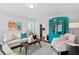 Stylish living room featuring a decorative china cabinet and comfortable seating arrangements at 4935 W Bay Way Pl, Tampa, FL 33629