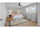 Bright bedroom featuring neutral walls, ceiling fan, decorative rug and comfortable furnishings at 506 71St Ave # 7, St Pete Beach, FL 33706