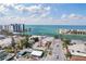 Aerial view of a coastal community with beachfront condos and a waterway leading to the ocean at 506 71St Ave # 7, St Pete Beach, FL 33706