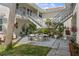 Exterior patio area featuring comfortable seating and staircase access at 506 71St Ave # 7, St Pete Beach, FL 33706