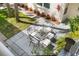 Patio area with table and seating, surrounded by lush greenery and landscaping at 506 71St Ave # 7, St Pete Beach, FL 33706