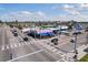 Street view of a commercial building with blue awnings and crosswalks, under a partly cloudy sky at 506 71St Ave # 7, St Pete Beach, FL 33706