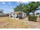 Back exterior of the house with an open patio area and fenced yard at 5121 Flamingo N Dr, St Petersburg, FL 33714