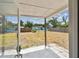View of the spacious backyard, showing a covered patio and large yard at 5121 Flamingo N Dr, St Petersburg, FL 33714