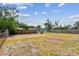 Large backyard space with wooden fence, providing a private outdoor area for recreation and relaxation at 5121 Flamingo N Dr, St Petersburg, FL 33714