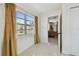 Bright hallway with large windows, and decorative gold drapes at 5121 Flamingo N Dr, St Petersburg, FL 33714