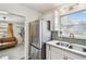 Well-appointed kitchen with stainless appliances and access to living area with comfortable leather seating at 5121 Flamingo N Dr, St Petersburg, FL 33714