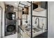 Functional laundry room with stacked washer/dryer and sink area at 5121 Flamingo N Dr, St Petersburg, FL 33714