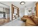Open-concept living space with seamless flow from the kitchen, cozy seating, and decorative shelving at 5121 Flamingo N Dr, St Petersburg, FL 33714