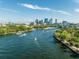 Aerial view of river with boat traffic and the city skyline in the background at 5406 N Pershing Pl, Tampa, FL 33603