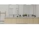 Bright bathroom with a double sink vanity, marble countertop, and decorative accents at 5406 N Pershing Pl, Tampa, FL 33603