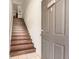 View of the stairs leading up to the unit, featuring solid wood treads at 5636 Baywater Dr # 5636, Tampa, FL 33615