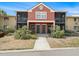 Charming condo with terra cotta exterior, well-kept landscaping, and screened in porch on both levels at 5636 Baywater Dr # 5636, Tampa, FL 33615