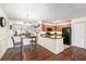 Open kitchen featuring dark wood floors, black appliances, and updated cabinetry at 5636 Baywater Dr # 5636, Tampa, FL 33615