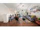 Bright living room featuring wood floors, comfortable seating, and sliding glass doors to the outside balcony at 5636 Baywater Dr # 5636, Tampa, FL 33615