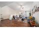 Bright living room featuring hardwood floors, comfortable seating, and an outdoor balcony at 5636 Baywater Dr # 5636, Tampa, FL 33615