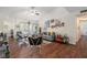 Inviting living room with vaulted ceilings, wood floors, and a sliding door to screened porch at 5636 Baywater Dr # 5636, Tampa, FL 33615