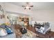 Spacious open-concept living area with wood floors flowing into an adjacent kitchen and dining area at 5636 Baywater Dr # 5636, Tampa, FL 33615