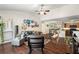 Spacious open-concept living area with wood floors flowing into an adjacent kitchen and dining area at 5636 Baywater Dr # 5636, Tampa, FL 33615